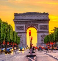 Champs-Elysees and Arc de Triomphe at night in Paris, France. Architecture and landmarks of Paris. Postcard of Paris